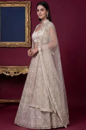 Rich Off-White Foil Work Net Reception Wear Lehenga Choli With Jacket
