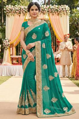georgette wedding wear saree in green with embroidery & crystals stone work 1