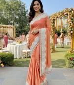 fancy art silk party wear saree in peach with embroidery work & crystal stone work