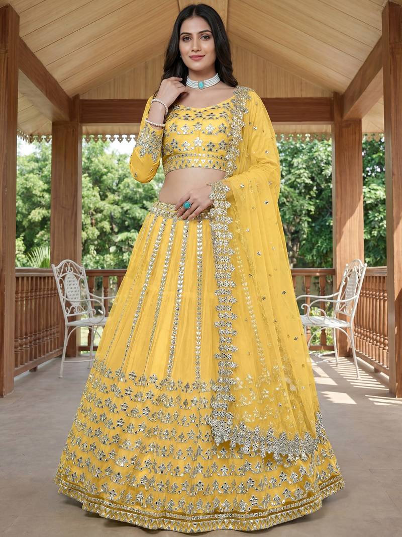 Alluring Yellow Foil Work Net Haldi Wear Lehenga Choli With Dupatta