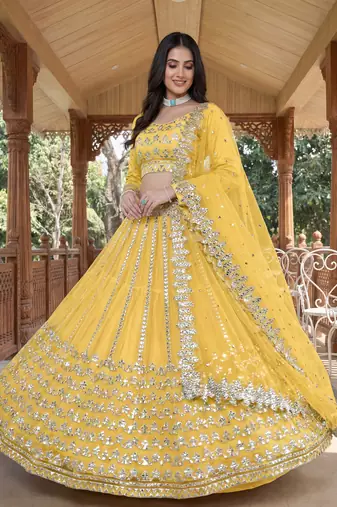 Alluring Yellow Foil Work Net Haldi Wear Lehenga Choli With Dupatta