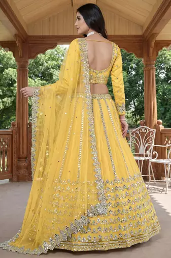 Alluring Yellow Foil Work Net Haldi Wear Lehenga Choli With Dupatta
