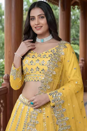 Alluring Yellow Foil Work Net Haldi Wear Lehenga Choli With Dupatta
