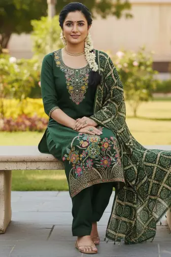 Green color beautiful stylish fancy suit for girlie looks