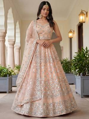 Glamorous Peach Zari Work Net Engagement Wear Lehenga Choli 1