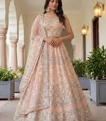Glamorous Peach Zari Work Net Engagement Wear Lehenga Choli