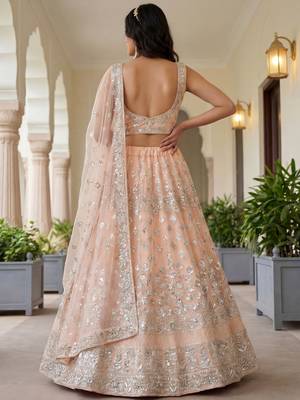 Glamorous Peach Zari Work Net Engagement Wear Lehenga Choli 3