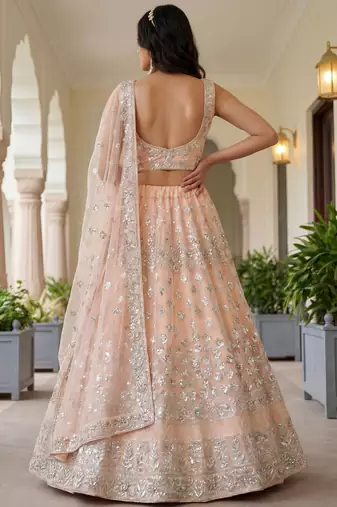 Glamorous Peach Zari Work Net Engagement Wear Lehenga Choli