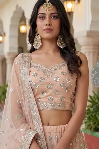 Glamorous Peach Zari Work Net Engagement Wear Lehenga Choli