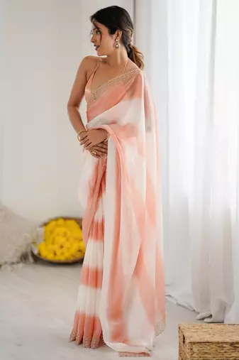 Peach satin saree with glamorous zarkan diamond work