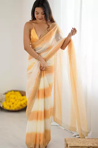 Yellow satin saree with glamorous zarkan diamond work