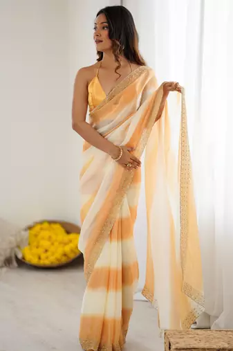Yellow satin saree with glamorous zarkan diamond work