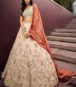Outstanding Soft Beige Embroidered Silk Wedding Wear Lehenga Choli