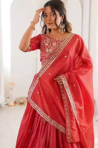 orange  designer lehenga choli with embroidered border