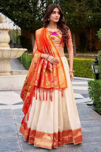 off-white lehenga with orange dupatta