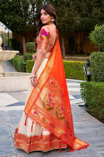 off-white lehenga with orange dupatta