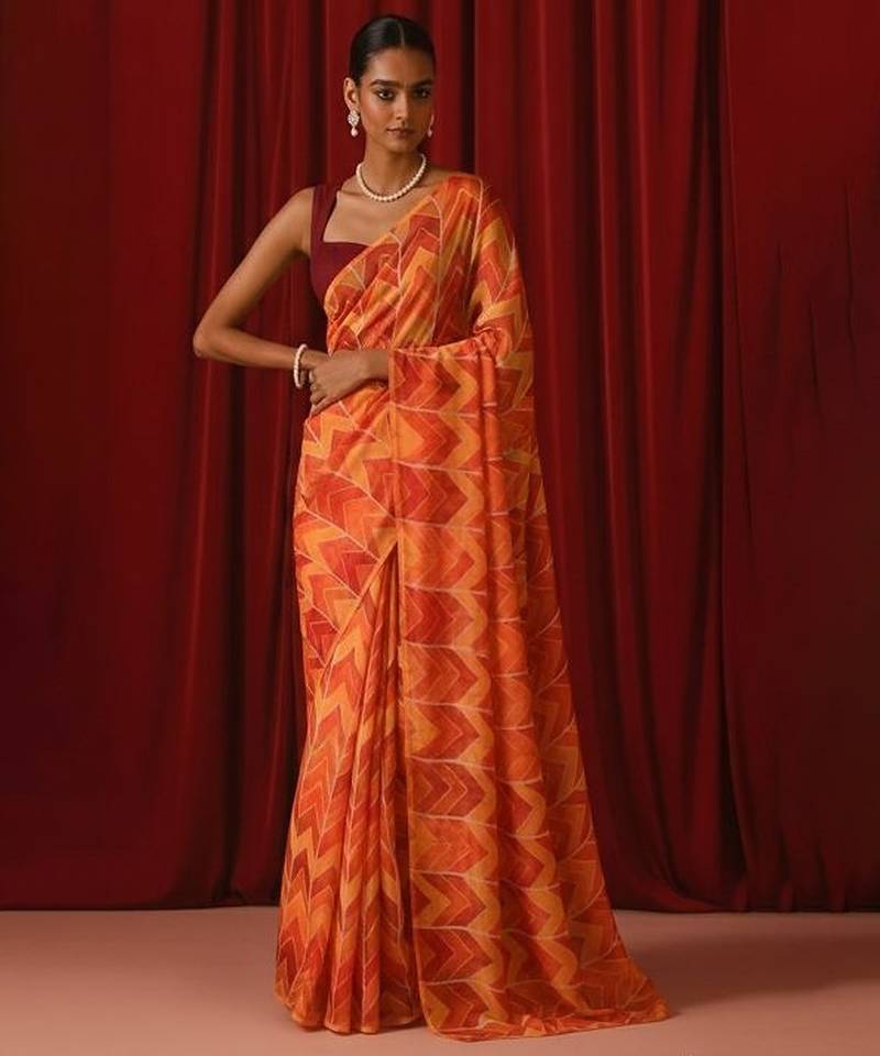 Orange printed georgette pre draped saree set