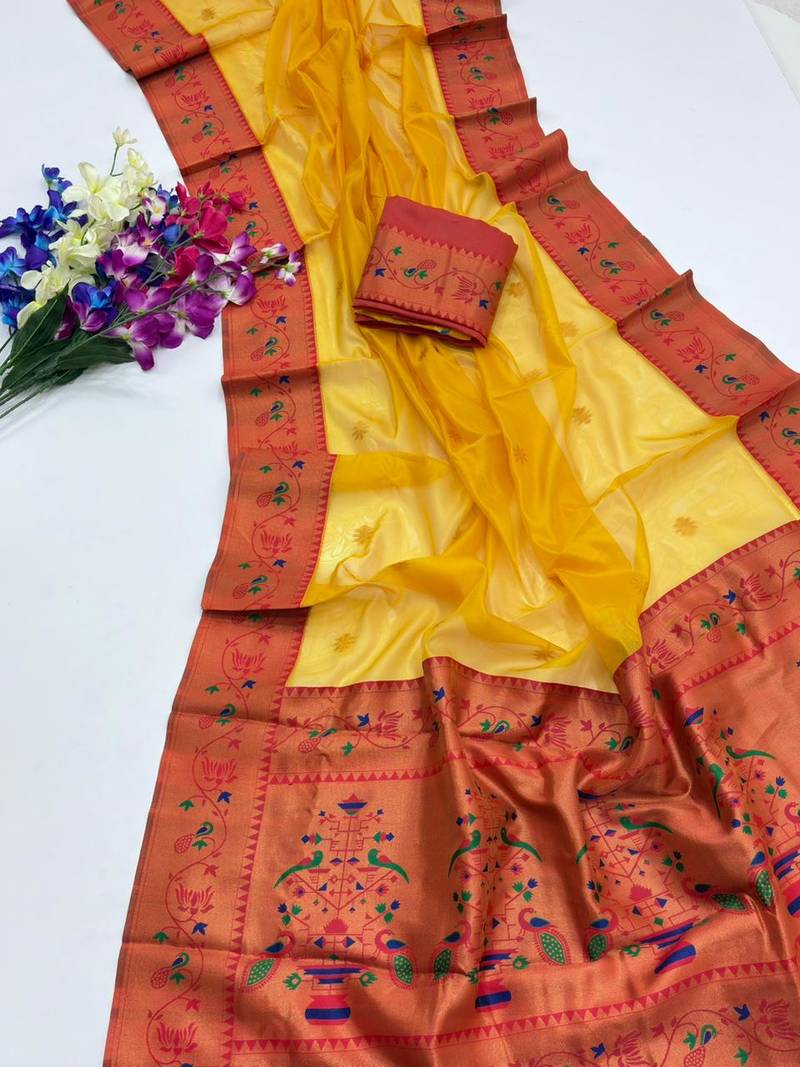 yellow color tissue art silk saree with contrast blouse