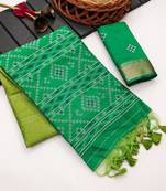 green color printed art silk saree with contrast blouse