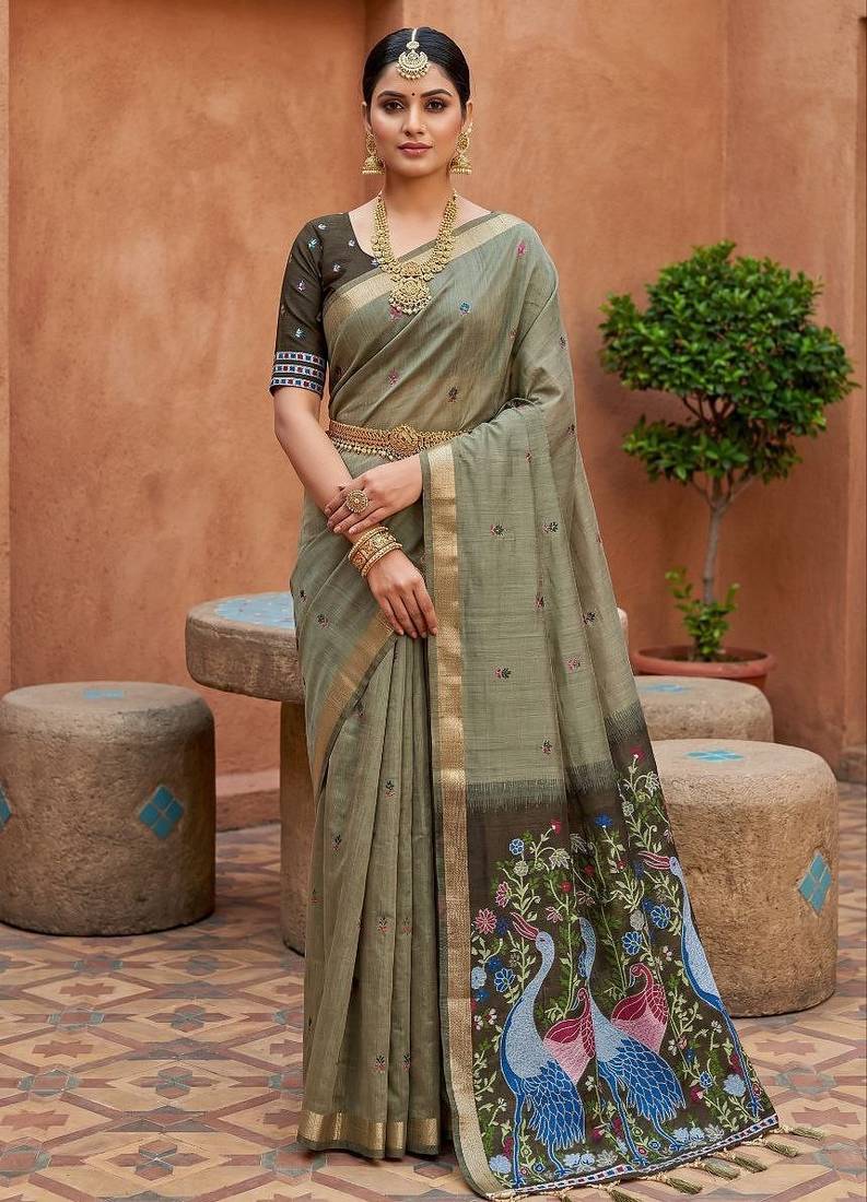green  soft pure muga cotton  saree with meenakari  weaving  motifs and contrast blouse