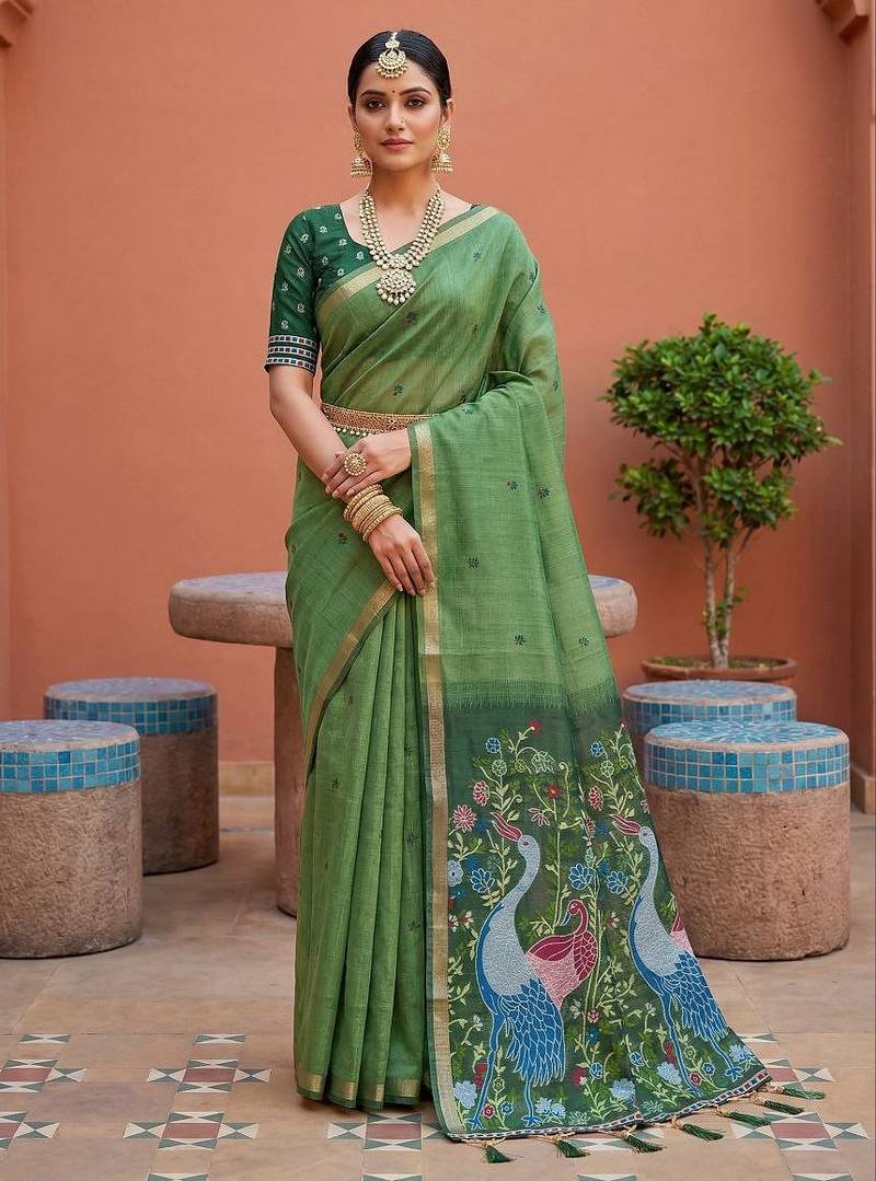 green  soft pure muga cotton  saree with meenakari  weaving  motifs and contrast blouse