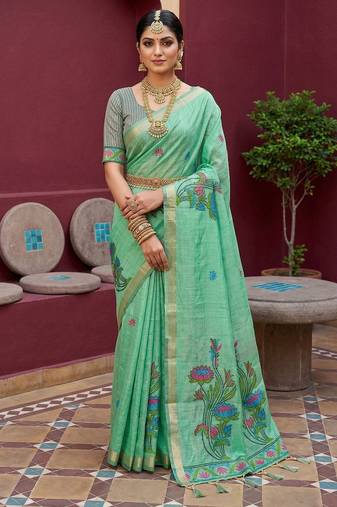green  soft pure muga cotton  saree with meenakari  weaving  motifs and contrast blouse