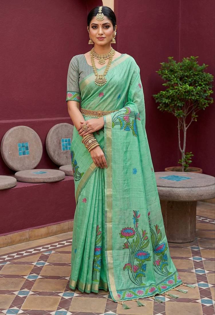 green  soft pure muga cotton  saree with meenakari  weaving  motifs and contrast blouse