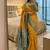 yellow soft silk blend saree with zari weaving meenakari design
