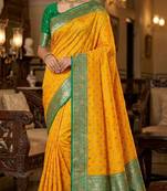 yellow soft banarasi silk saree with zari weaving meenakari design
