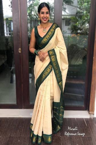 Traditional cream green border silk blend saree