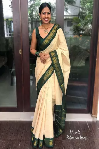 Traditional cream green border silk blend saree