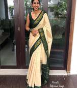 Traditional cream green border silk blend saree