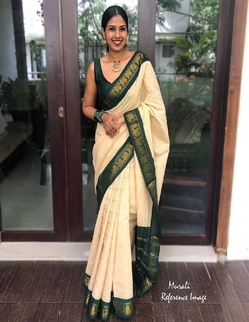 Traditional cream green border silk blend saree