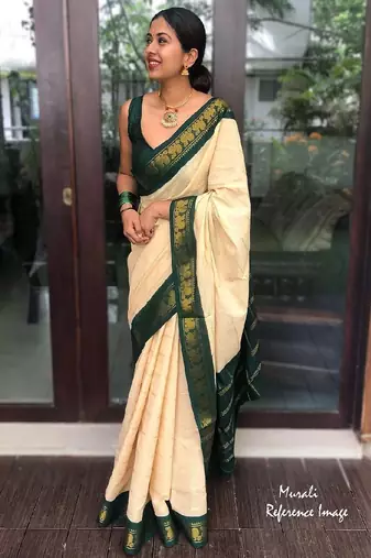 Traditional cream green border silk blend saree