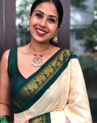 Traditional cream green border silk blend saree 4