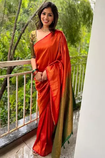 Vibrant orange traditional silk blend saree