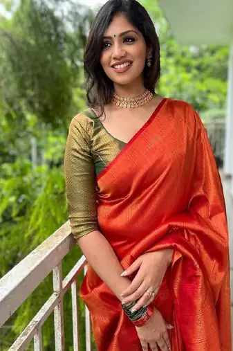 Vibrant orange traditional silk blend saree