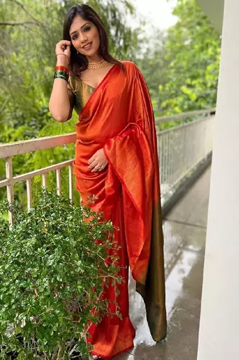 Vibrant orange traditional silk blend saree