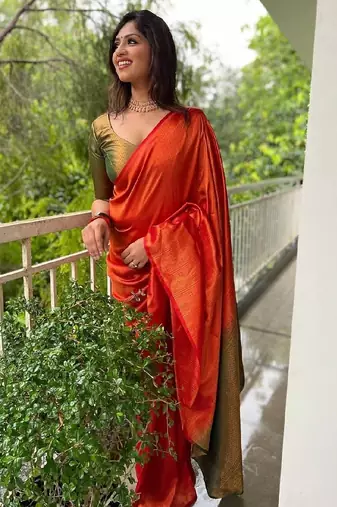 Vibrant orange traditional silk blend saree