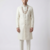 Pristine white handcrafted intricate thread work raw silk wedding sherwani with embellished mandarin collar