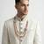Pristine white handcrafted intricate thread work raw silk wedding sherwani with embellished mandarin collar