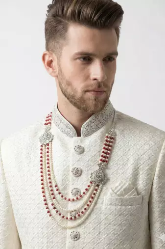 Pristine white handcrafted intricate thread work raw silk wedding sherwani with embellished mandarin collar