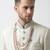 Pristine white handcrafted intricate thread work raw silk wedding sherwani with embellished mandarin collar