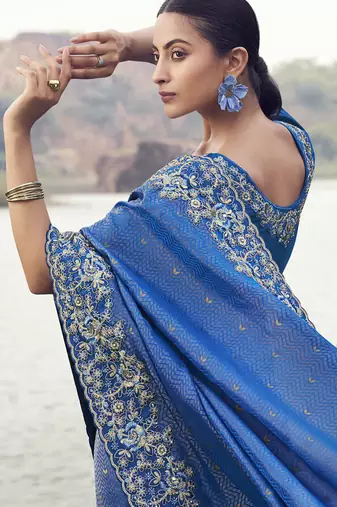 Blue satin with jacquard butti, sequince work , heavy embroidery & khatli work saree