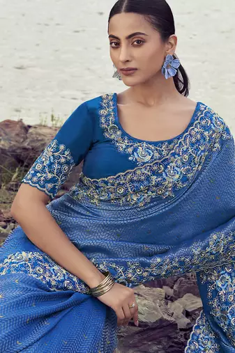 Blue satin with jacquard butti, sequince work , heavy embroidery & khatli work saree