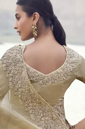 Beige tissue with jacquard butti, sequince work , heavy embroidery & khatli work saree