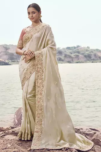 Cream satin silk, sequince work, heavy embroidery & khatli work saree