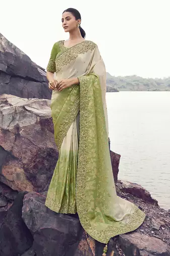 Shaded off-white & olive tissue with jaquard, sequince work, heavy embroidery & khatli work saree