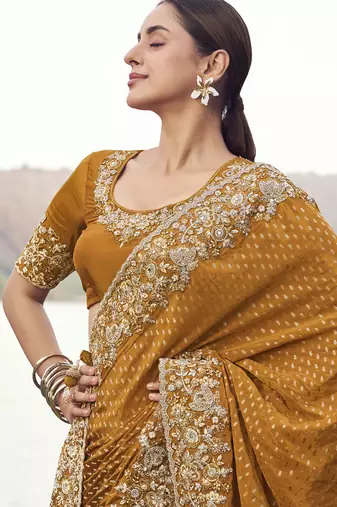 Copper satin with jaquard sequince work, heavy embroidery & khatli work saree