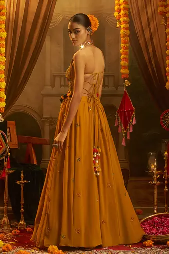 Mustard Yellow Georgette Lehenga with Hand Embroidered Halter Blouse and Tassel Shell Detail